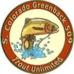 A brown and white logo with a fish jumping in the air.